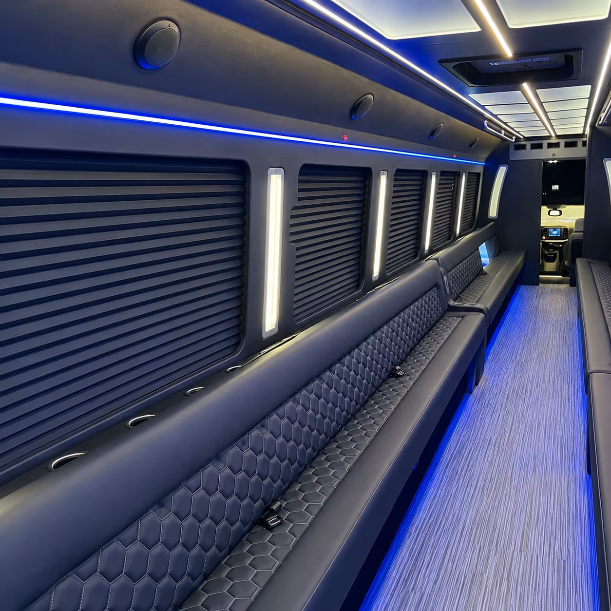 Group beside a Mercedes Sprinter limo in Denton